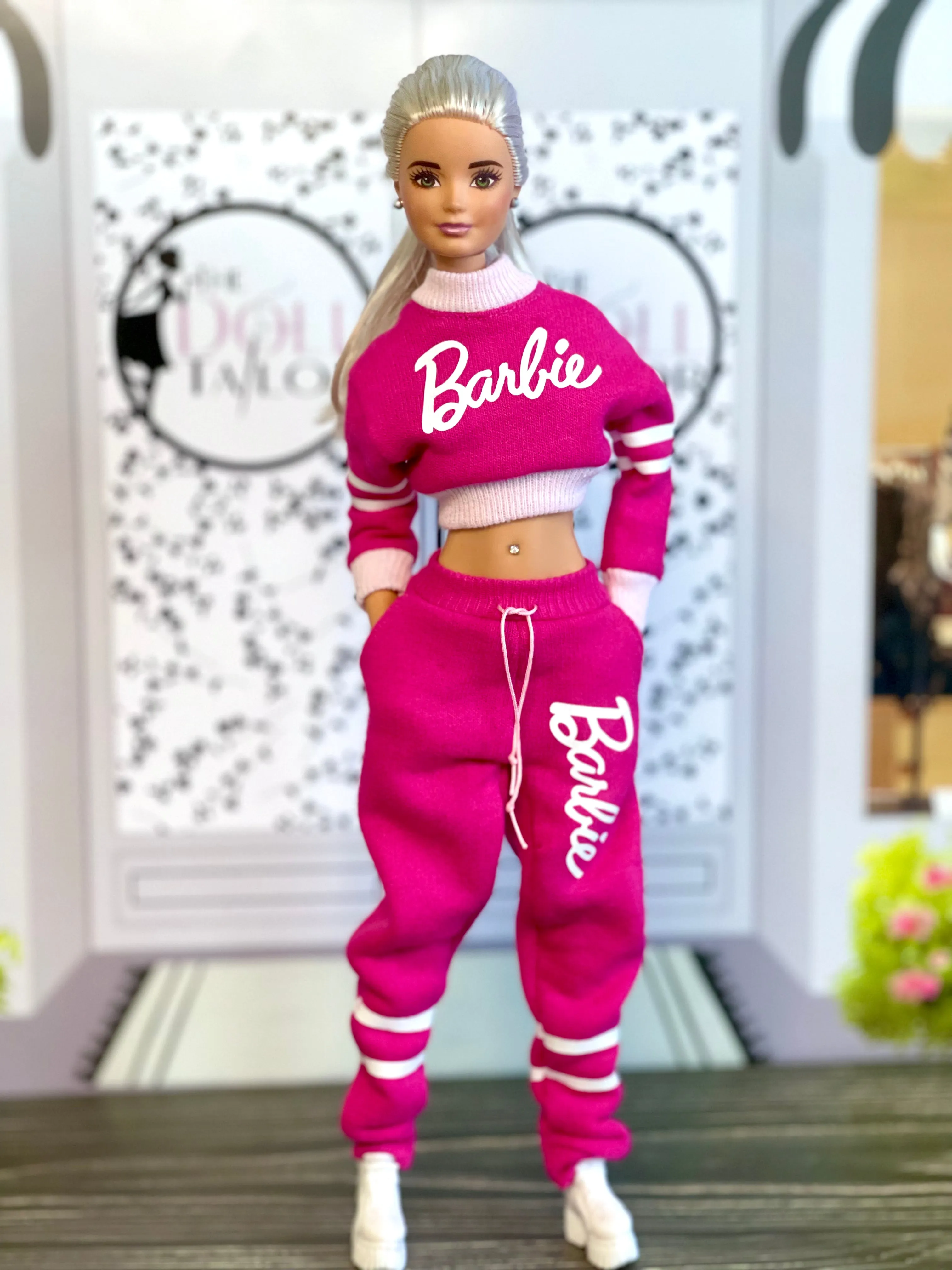 Pink sweatpants and sweatshirt for Barbie doll with logo